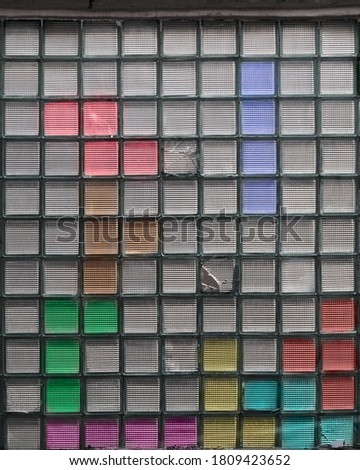 Old window with many colorful glasses. Concept of Logic game  Theme in decor.