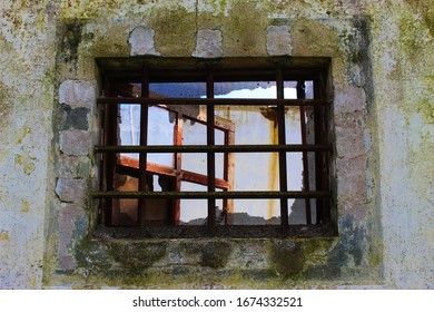 old window with rusty bars on old wall, abandoned wall, background