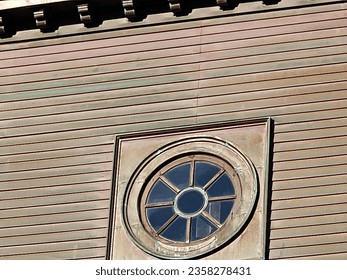 An old window in the side of a building.