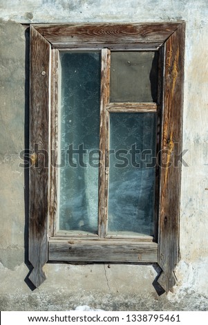 Rusty window with flower pots