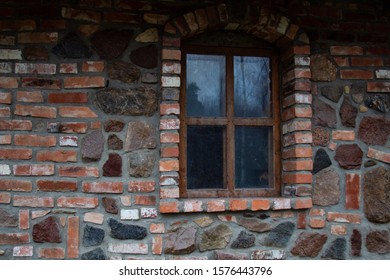 old window in a stone wall