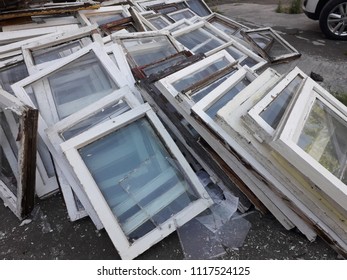 Old windows of wooden frames, dismantled.