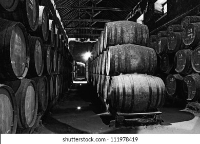 Old Wine Barrels In A Wine Cellar