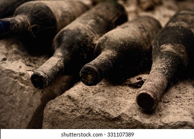 Old Wine Bottles On A Stone Step, A Cave