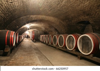 An Old Wine Cellar With Barrels