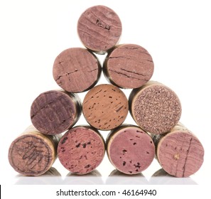 Old Wine Corks Arranged In Pyramid,  Isolated On White