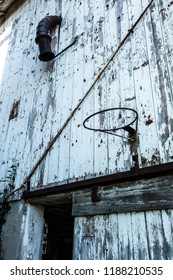 old wisconsin barn with a basketball hoop on the side of the building