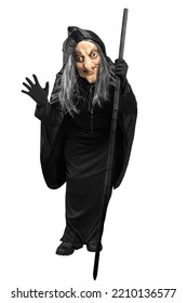 Old Witch In A Cloak Standing With A Stick Isolated Over White Background