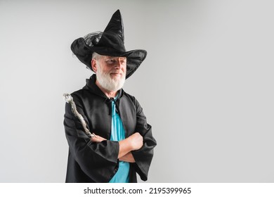 Old Wizard Man  Shows Magic Wand In A Halloween Costume, On A White Background