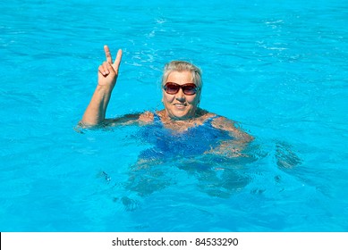 The Old Woman 70-75 Years Old, Swims In The Pool