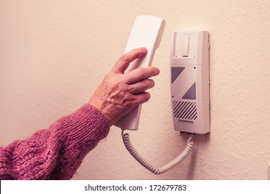 Old Woman Answering Intercom