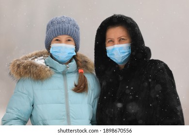 Old Woman In A Black Mink Coat Wearing A Medical Mask