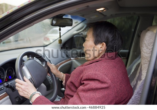 old woman in the
car