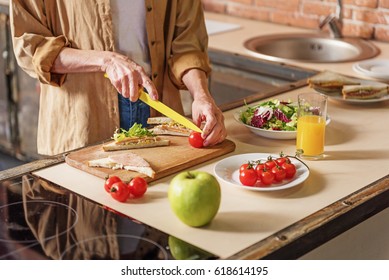 Old Woman Chopping Healthy Vegetables