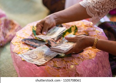 Old Woman Decorating Dowry