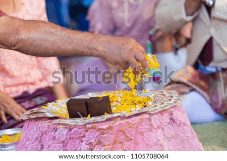 Old woman decorating dowry