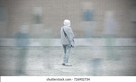 Old Woman With Dementia Among The Society. Alzheimer Concept With Empty Copy Space For Editor's Text.