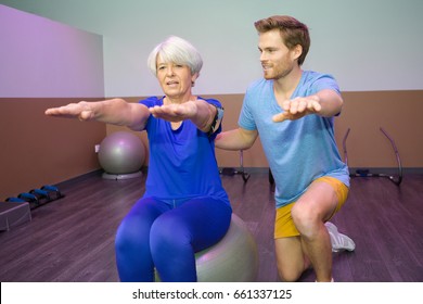 old woman doing physical therapy on the ball - Powered by Shutterstock