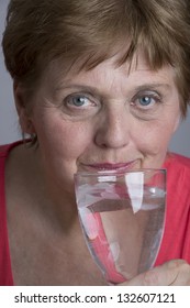 Old Woman Drinking Mineral Water