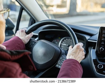 old woman driving a car - Powered by Shutterstock