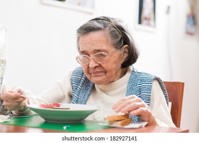 Old Woman Eating Her Lunch At Home 