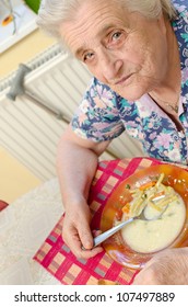 Old Woman Eating Soup