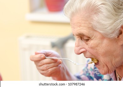 Old Woman Eating Soup