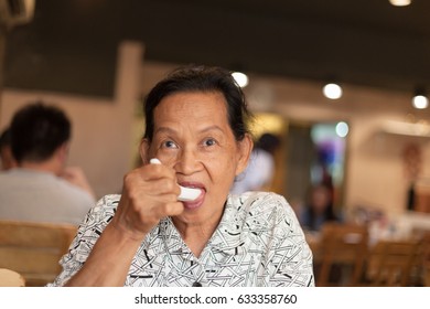 Old Woman Eating Soup