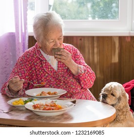 Old Woman Eating Soup At Home