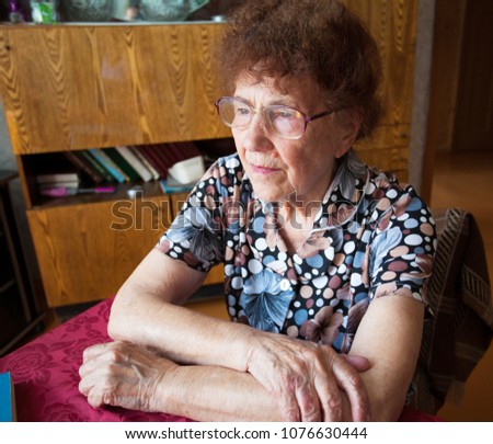 Similar – Image, Stock Photo Senior woman in a wheelchair alone in a room