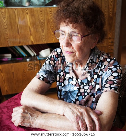 Similar – Image, Stock Photo Senior woman in a wheelchair alone in a room