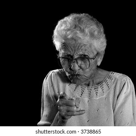 Old Woman With Glasses Wagging Her Finger in Anger