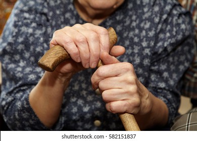 Old woman hands with cane. Senior people health care