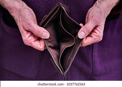 Old Woman Hands Holding Open An Empty Wallet. Finance Problems.