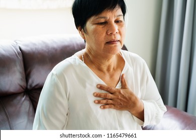 Old Woman Having Heart Attack And Grabbing Her Chest