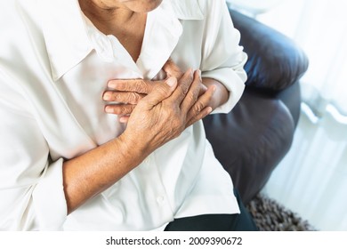 Old Woman Having Heart Attack And Grabbing Her Chest