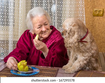 Old Woman And Her Dog In The Kitchen
