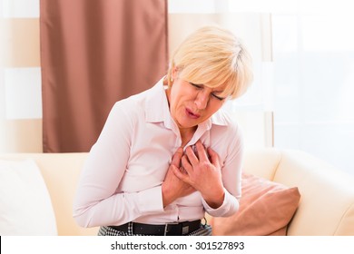 Old Woman Holding Breast Because Of Heart Infarction 