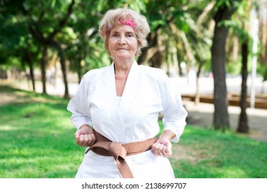 Old woman in kimono training in park