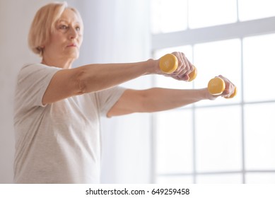 Old Woman Looking Straight While Concentrating