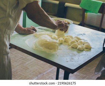 Old Woman Making Dough Balls For Patties