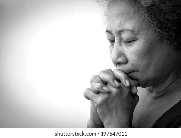 Old Woman Praying On White Background