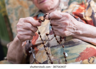 Old Woman Praying The Rosary