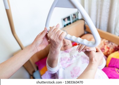 An Old Woman Pulls Herself Up On A Gallows