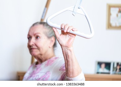 An Old Woman Pulls Herself Up On A Gallows