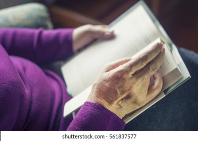 Old Woman Reading A Book At Home