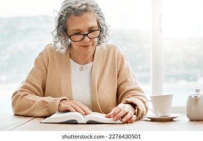 Old woman reading book, story or bible to relax in hobby or retirement for peace or learning religion. Elderly studying or calm senior person with novel for information or knowledge on table at home - Powered by Shutterstock