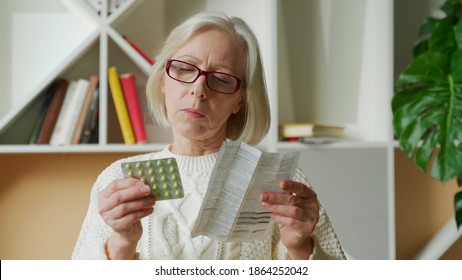 Old Woman Reading Medicine Pills Instruction. Senior Lady Reading Instruction Pills