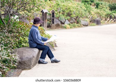 Old Woman Reading A Pamphlet