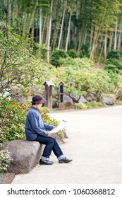 Old Woman Reading A Pamphlet